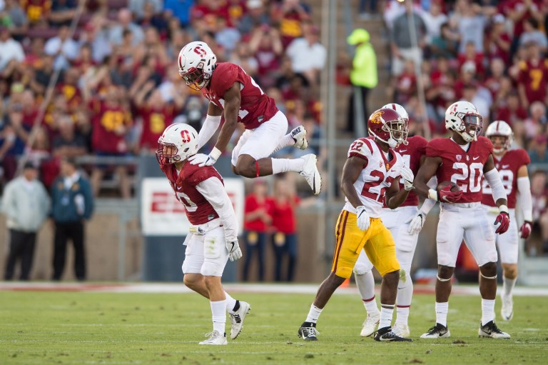 Fifth-year senior linebacker Peter Kalambayi (second from left) celebrates during Stanford's 27-10 win over USC last season. Kalambayi will be key in stopping Heisman contender Sam Darnold on his home turf this Saturday. (KAREN AMBROSE HICKEY/isiphotos.com)