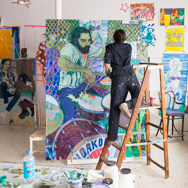 Hope Gangloff works on a portrait (Courtesy of Vogue).