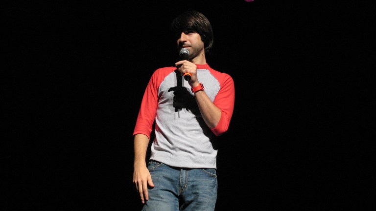 Demetri Martin performs on his "Let's Get Weird" tour (Courtesy of CBS).