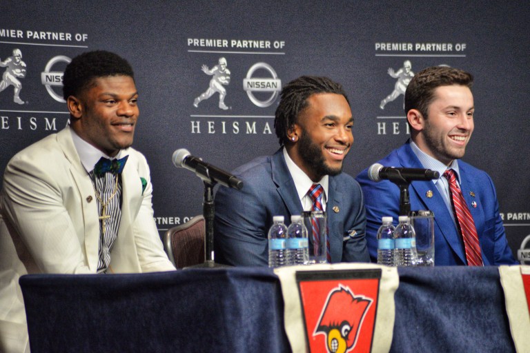 Junior running back Bryce Love (center) came in second in the Heisman vote to Oklahoma's Baker Mayfield (right) and ahead of last year's Heisman winner, Louisville's Lamar Jackson (left).(DON FERIA/isiphotos.com)