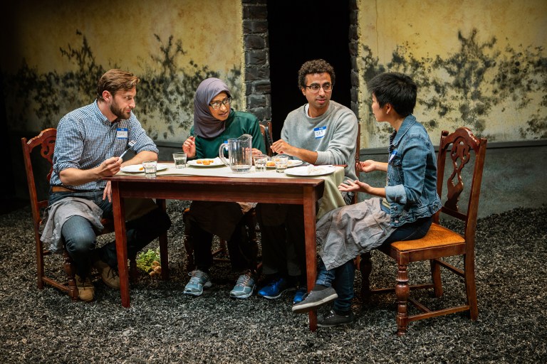 Justin (Josh Schell, left) and Sarah (Sango Tajima, right) share dinner at their new inn with guests Soha (Sam Jackson) and Jai (Mohammad Shehata). (Courtesy of Jessica Palopoli)