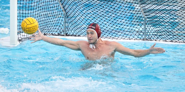 Senior goalkeeper Oliver Lewis (above) tried his best to keep Stanford in the game against USC, but was unable, as the Trojans scored 14 total goals on him during the finals. (HECTOR GARCIA-MOLINA/isiphotos.com)