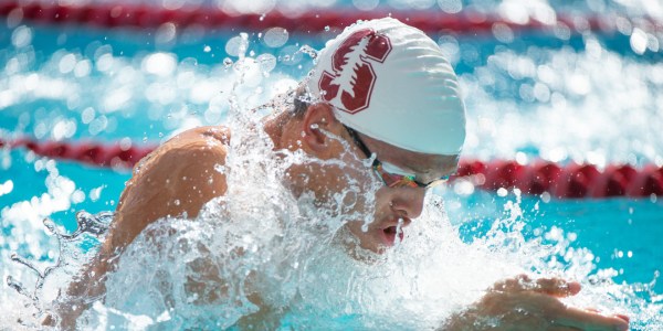 Junior Hank Poppe, seen above swimming breaststroke, shocked his teammates when he snagged the first place spot in the 100 Fly, an event in which he does not normally compete. (JOHN TODD/isiphotos.com)