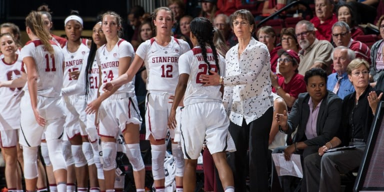 Stanford coach Tara VanDerveer congratulates players as they exit the court during Sunday's game. The Cardinal won two games this past week, helping VanDerveer reach 900 career wins.