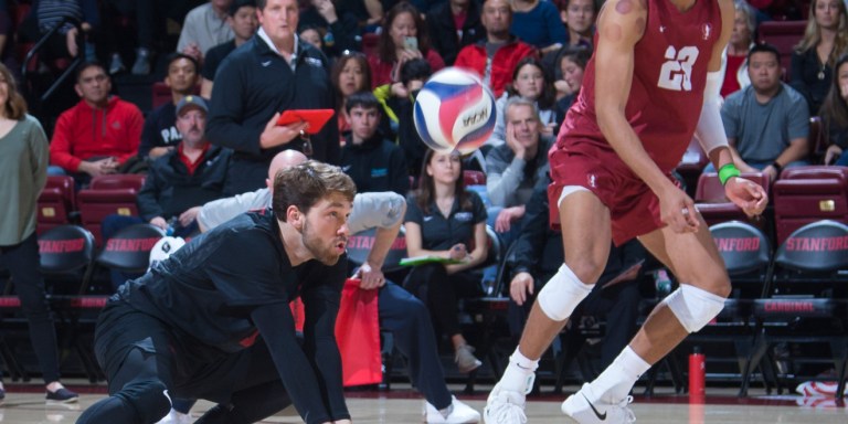 Redshirt senior Kyle Dagostino (above, in black) leads the men's volleyball team with 2.02 digs per set. (AL CHANG/isiphotos.com)