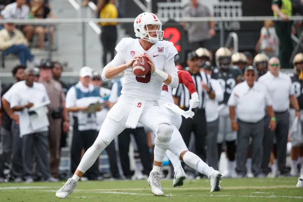 Last season, senior quarterback K.J. Costello (above) was the highest-rated QB in the Pac-12. This year, that title has been bestowed upon Oregon's Justin Herbert. The two talented QBs will clash on Saturday at Stanford. (BOB DREBIN/isiphotos.com)