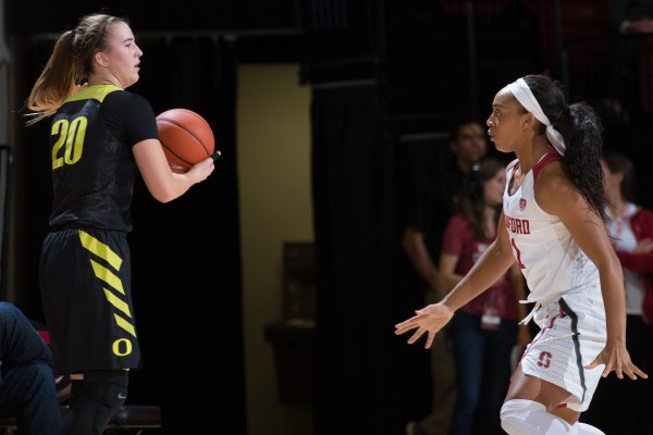 Senior guard Dijonai Carrington (above, right) defends Oregon's senior guard Sabrina Ionescu (above, left). Both the Cardinal and the Ducks were ranked No. 1 earlier this season. (PHOTO: Andrew Villa/isiphotos.com)