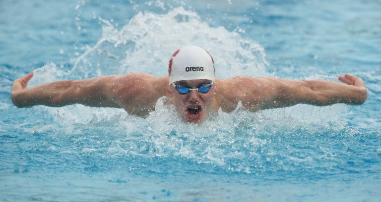 Senior Will Macmillan (above) secured three first-place finishes in individual events this weekend.  In the 100-yard freestyle, Macmillan surged ahead to win at the wall. (Photo: CODY GLENN/isiphotos.com)