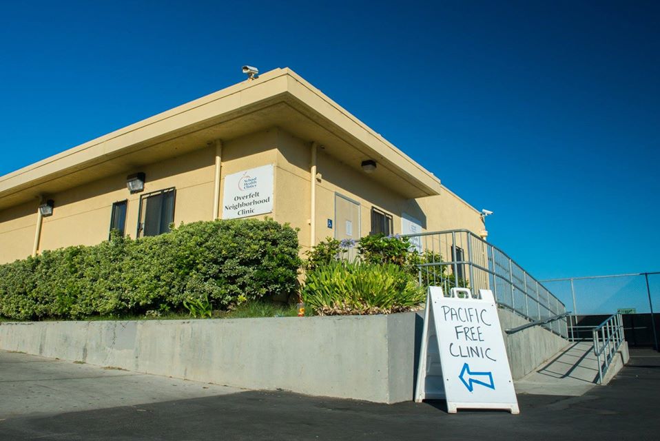 Sign points toward the Pacific Free Clinic