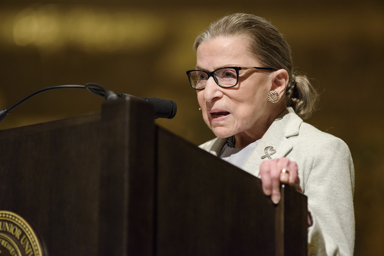 Ruth Bader Ginsburg speaks at a podium at Stanford.