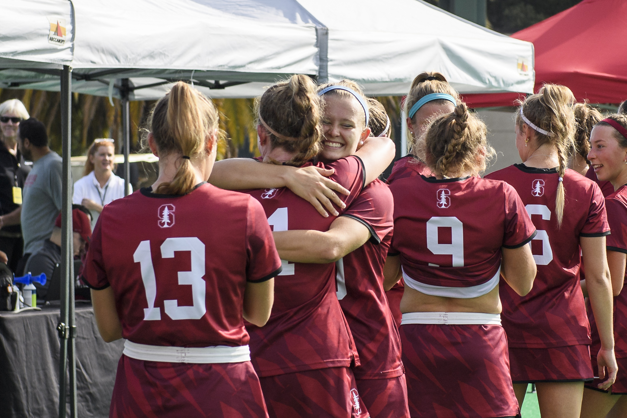 Corinne Zanolli embraces a teammate.