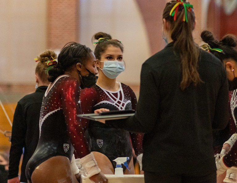 Kyla Bryant (left) and Grace Garcia (right) finished one, two on the uneven bars in season opener against San Jose State. (Photo: JOHN LOZANO/isiphotos.com)