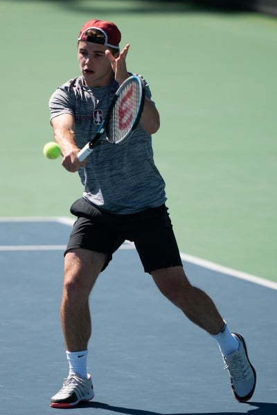 Freshman Arthur Fery (above) was the first off the court in both his doubles and single matches, helping the Cardinal win its conference opener. (Photo: DON FERIA/isiphotos.com)