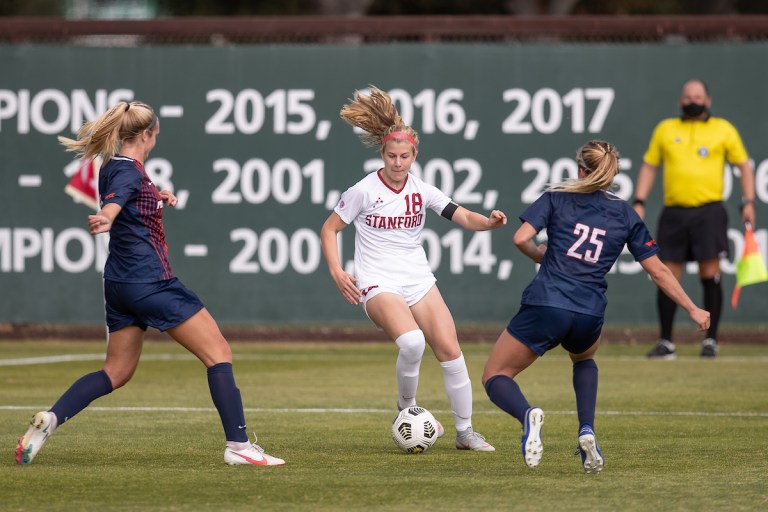 Freshman midfielder Catherine Paulson (above, middle) works her way between two Pepperdine players in the Cardinal's earlier season matchup. Paulson was a key player in Friday's win over Utah. (Photo: MACIEK GUDRYMOWICZ/isiphotos.com)