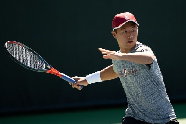 Senior Timothy Sah (above) is the reigning Pac-12 Player of the Week after clinching two Cardinal wins last week. Stanford men's tennis will face Washington on Sunday to close the regular season. (Photo: DON FERIA/isiphotos.com)