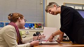 Juliet Brodie working with a student.