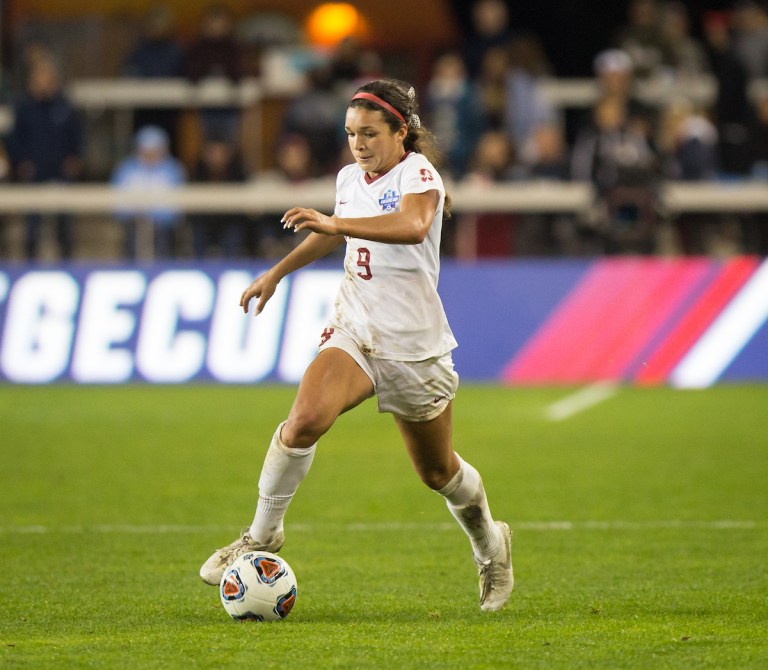 Sophia Smith dribbling a ball down the field.