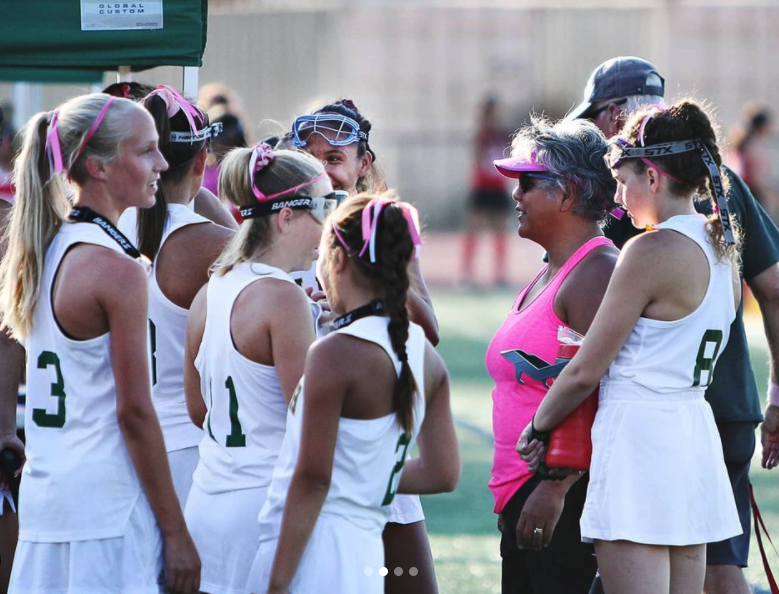 De los Reyes coaching one of her field hockey teams