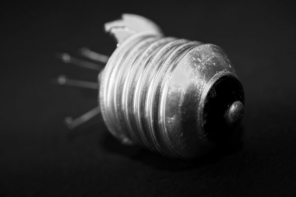 A monochromatic photo of a broken lightbulb