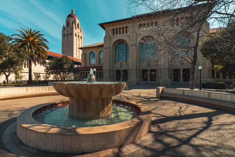 Green Library with a fountain in the foreground.