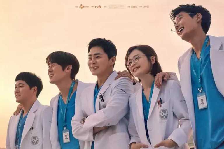 Five medial professionals from the "Hospital Playlist" drama stand in a line, dressed in uniform