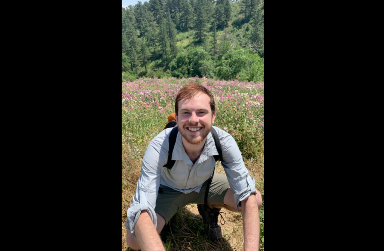 A photo of Jacob Meisel hiking in Colorado