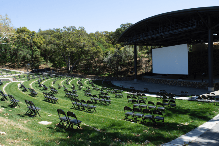 Frost with chairs set up facing projector and stage.