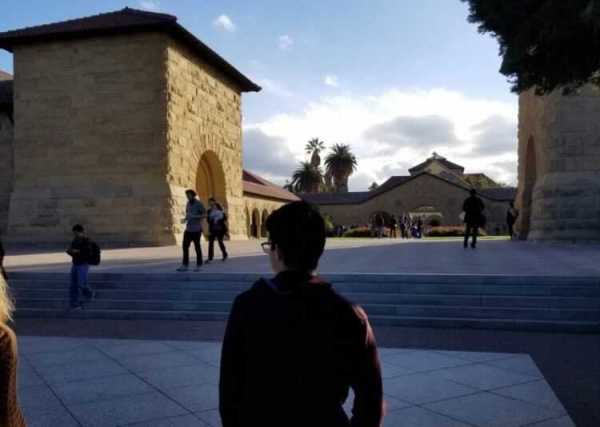 A student looks up the steps leading to Memorial Court