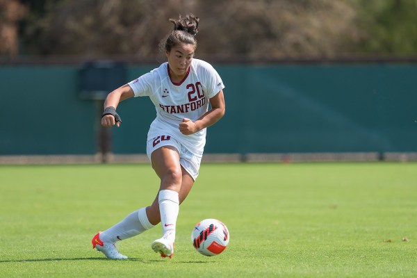 Andrea Kitahata dribbles the ball.