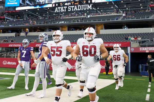 Stanford football's Drake Metcalf and Drake Nugent jog onto the field at AT&T Stadium.