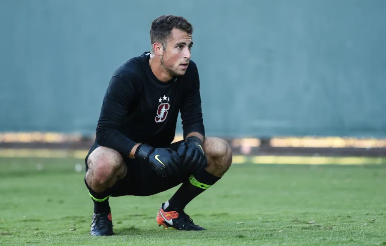 Matt Frank squats to rest following a play.