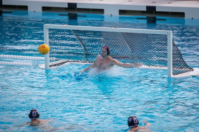 The ball shot at the water polo goal