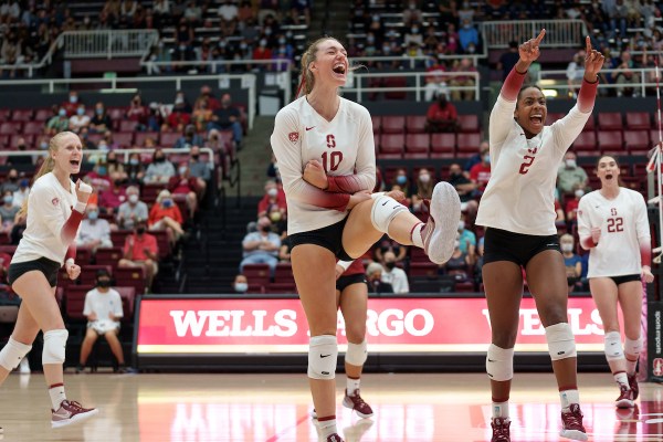 Kendall Kipp celebrates a big point along with Alex Lougeay and Kami Miner.