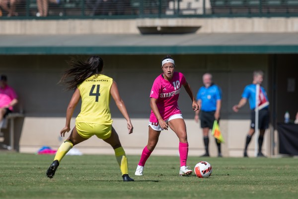 Maya Doms dribbles the ball towards a defender.