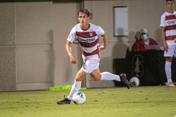 Ryan Dunn dribbles the ball.