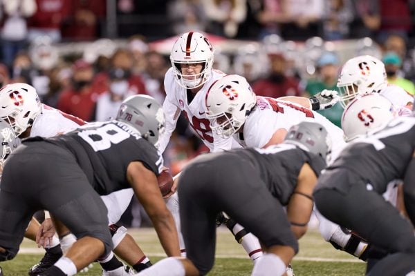 Tanner McKee receives the snap at the start of a play.