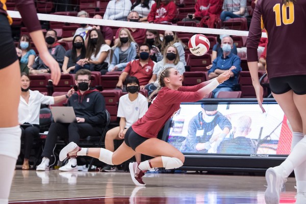 Freshman defensive specialist Taylor Beaven dives for a dig.