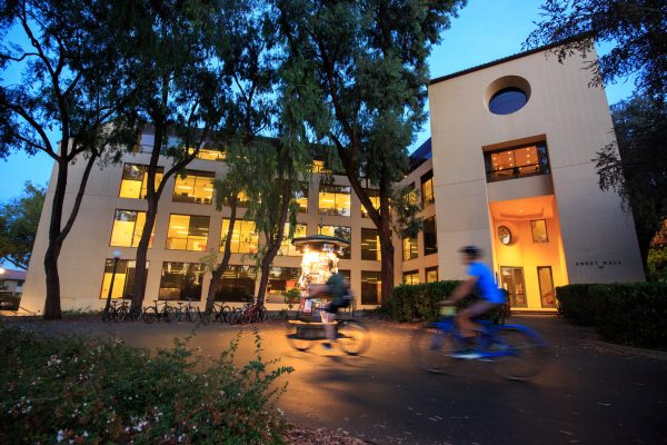 A photo of Sweet Hall with the lights on at night