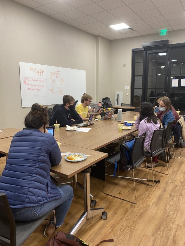 Graduate Student Councilors sit around table in EVGR