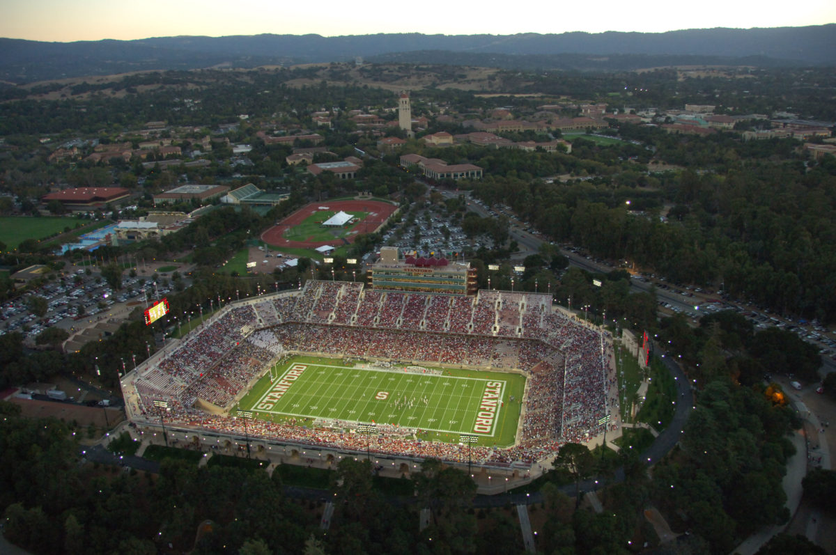 An arial photo of a packed Stanford Stadium under the lights