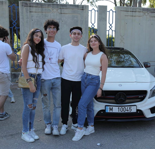 Bizri and three friends posing for a photo in Birzi's home country, Lebanon