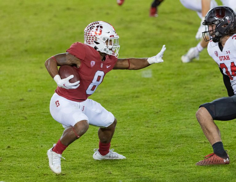 Nathaniel Peat (8 above) during a game between University of Utah and Stanford