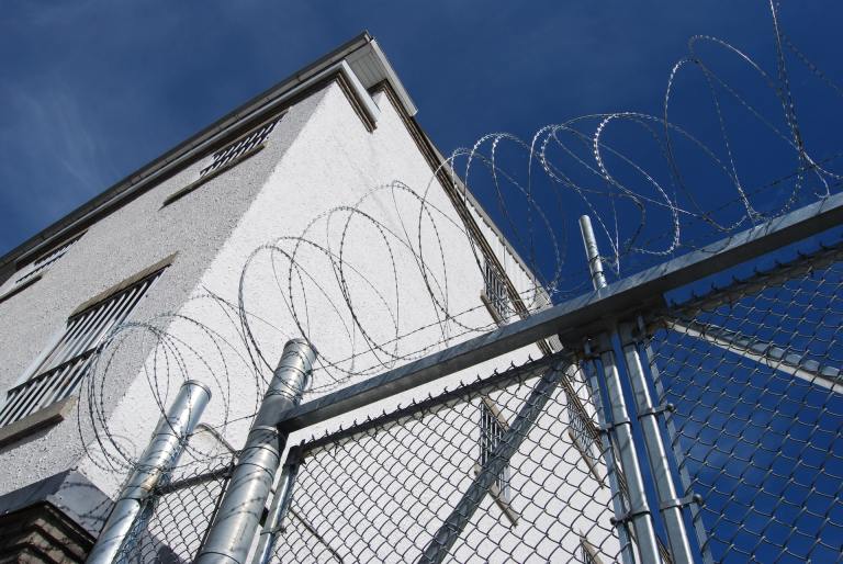 A photo of barred wire on a fence