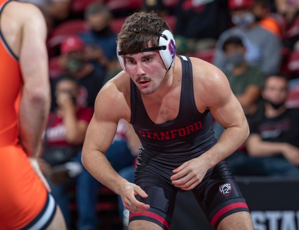 Jackson DiSario crouches ready during a wrestling match.