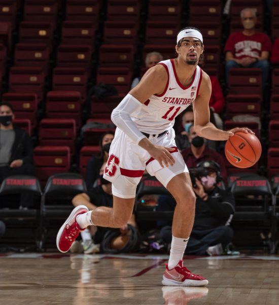 Jaiden Delaire dribbles the ball in Maples Pavilion.