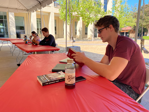 Students study and communicate from socially-distanced, outdoor desks in the Medieval Fantasy Literature course.