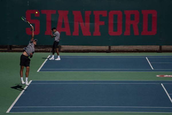 Aryan Chaudhary serves the ball at Taube Family Tennis Center