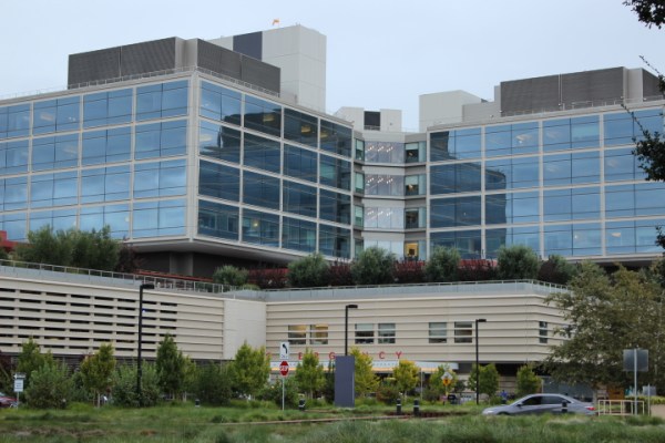 Car passes by on street in front of the Emergency Department of the Stanford Hospital