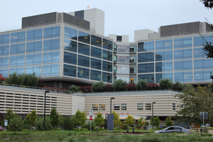 Car passes by on street in front of the Emergency Department of the Stanford Hospital