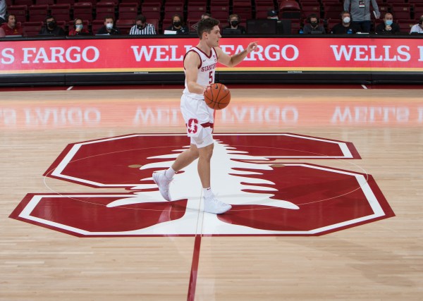 Michael O'Connell dribble the ball across half court.